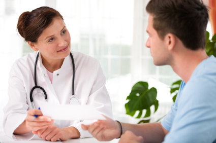 female-doctor-talking-to-male-patient.jpg