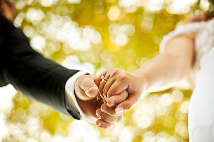 newlywed-couple-holding-hands.jpg